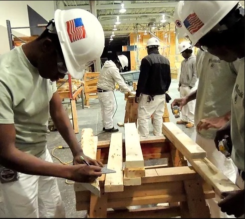 Young men working at the YouthBuild Carpentry Apprenticeship