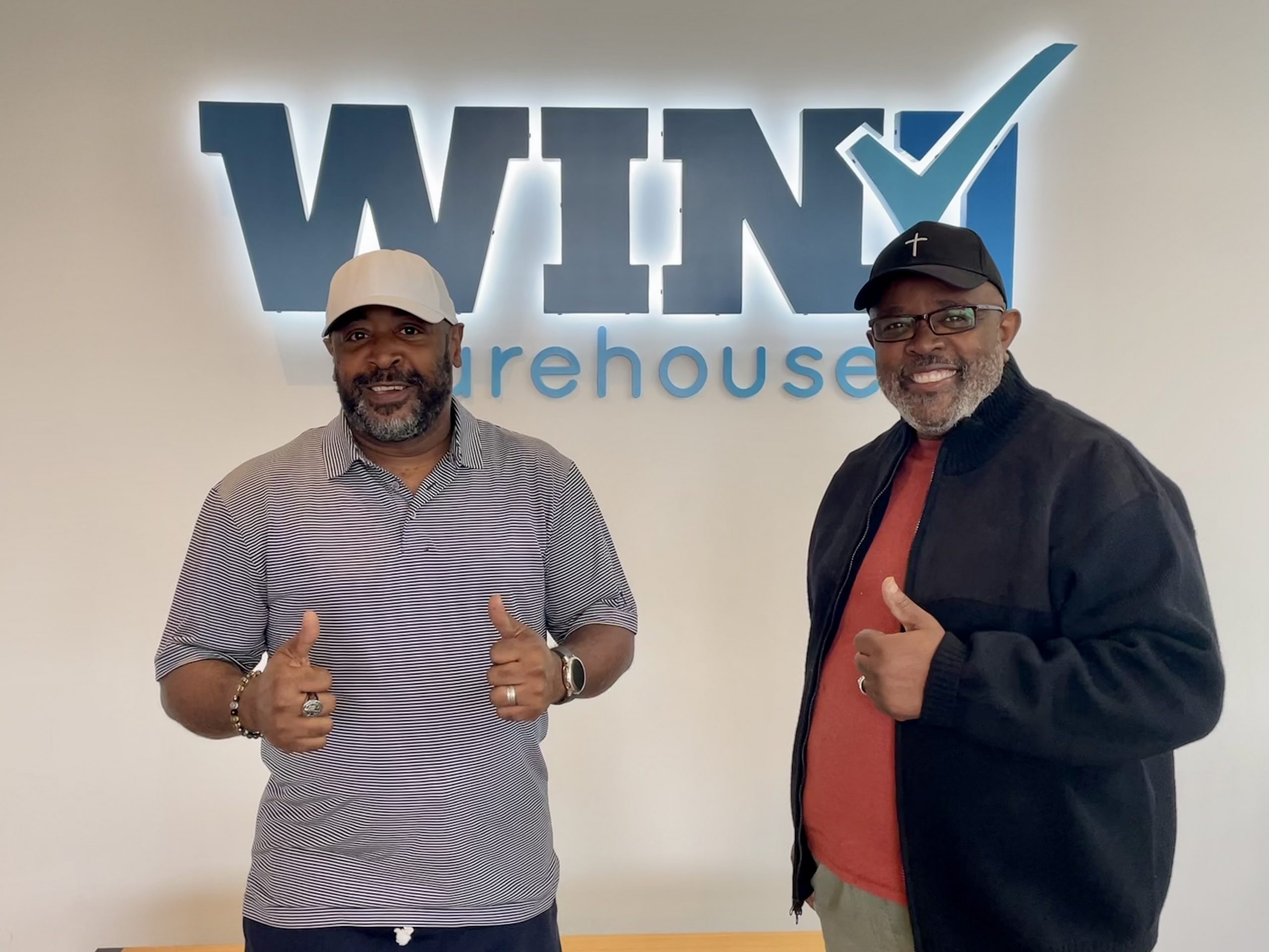 Two smiling men from Emmanuel Temple Church of God